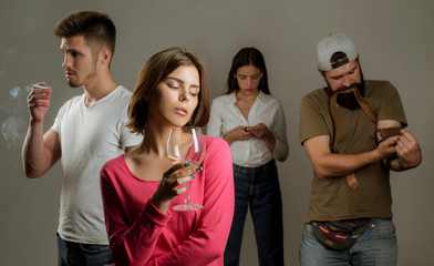Stop alcohol addiction. Addictive group including alcohol cigarettes and drugs. Hard drugs and alcohol addict. Serious sad woman having alcohol addiction. - obrazy, fototapety, plakaty