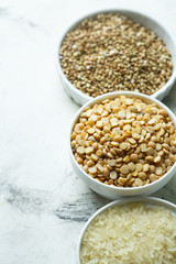 Assorted grains in the white bowls