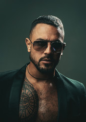 Obraz premium American man. Sexy brutal man in glasses. Stylish man - casual clothing and eyeglasses. Glasses for man. Protect eyeglasses.