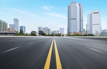 The expressway and the modern city skyline are in Chongqing, China.