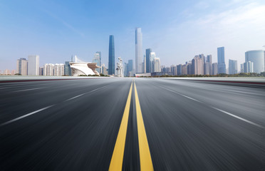 Obraz premium Empty road floor surface with modern city landmark buildings of guangzhou bund Skyline