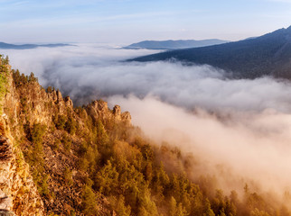 Foggy mountain landscape at sunset