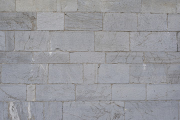 Stone wall background and ancient tuff, Tuscany in Italy