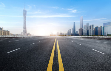 Empty road floor surface with modern city landmark buildings of guangzhou bund Skyline