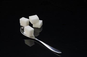 Cucharilla con terrones de azucar