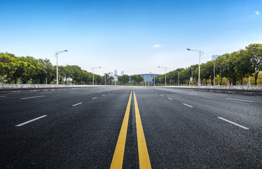 Fototapeta premium Empty road floor surface with modern city landmark buildings of guangzhou bund Skyline