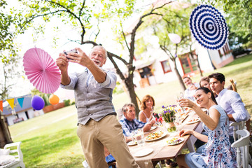 Family celebration or a garden party outside in the backyard.