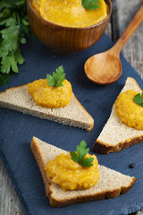Cabbage caviar in a wooden bowl and bruschetta