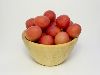 Fresh tomatoes in a wooden basket