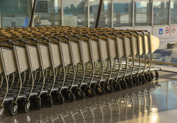 Airport trolley parking lot with empty trolleys