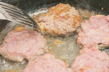 Preparation of homemade meatballs from minced meat. Fry the cutlets in a frying pan.