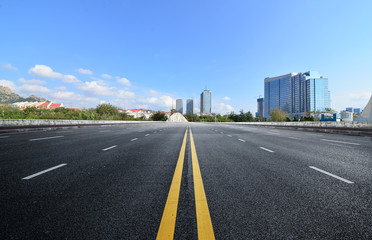 Fototapeta premium The expressway and the modern city skyline are in qingdao, China.