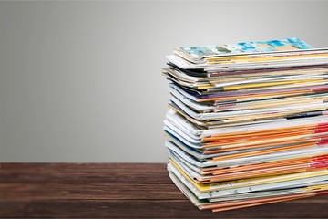 Pile of newspapers on white background