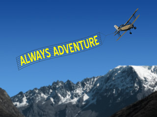 Fototapeta na wymiar Always Adventure banner with plane on mountainous background