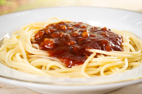 Closeup spaghtti red sauce in white plate. Italian food.