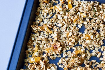 Tasty oat granola on the baking sheet.
