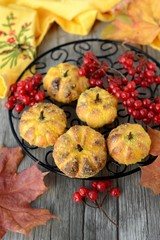 Pumpkin cookies with leaves and berries