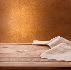 Empty wooden table with tablecloth. Napkin close up top view mock up. Kitchen rustic background.