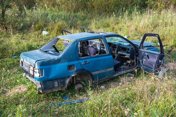 Obraz na płótnie Canvas Abandoned old destroyed car close up shot.