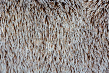 Brown fur is pleasant to the touch, pile. Background.