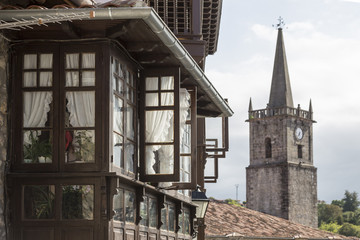 gallery and clock tower in Comillas, Cantabria, Spain