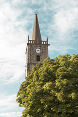 Fototapeta na wymiar bell tower with clock, Comillas, Cantabria, Spain