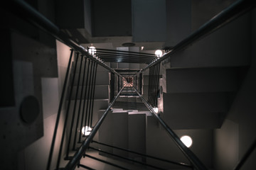 Modern staircase bottom-up view in a low light