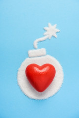 The bomb made of sugar on blue blue background. Diabetes concept. Sugar Kills. Suggesting dieting...