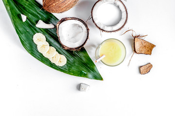 cocktail with coconut on white background top view
