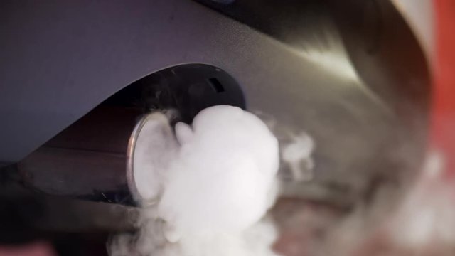 DUAL AUTO EXHAUST WITH HEAVY WHITE SMOKE, ECU IN SLOW MOTION, 180 FPS.