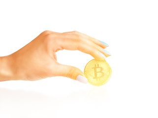 Bitcoin - symbol of cryptocurrency in a hand.