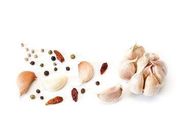 Raw garlic segments and peppers.