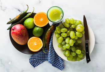 colored vegetables and fruits on the table. preparation of morning juices. healthy eating