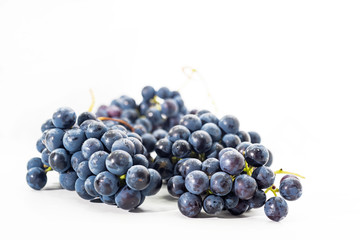 Raw dark grapes isolated on white background. Autumn abstractions.