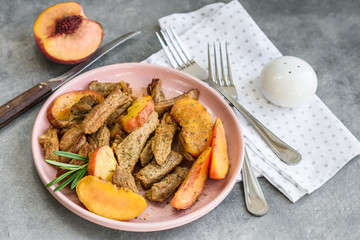 Pork meat with peach.