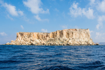 Filfa island in the blue Mediterranean sea near Blue Grotto in the south of  Malta 