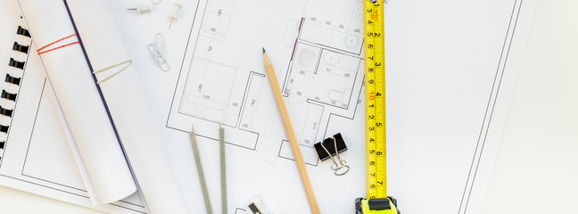 Interior designer table workplace with house plan