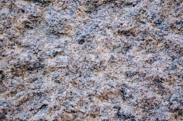 Marble slab rough processing. Part of the wall. Orange and Gray