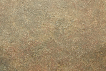 Home construction planning and design for earth tone walls and floors using natural stone and rock for building materials.