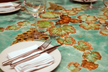 empty restaurant table settings with plates and tableware