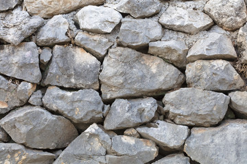 Stone wall from a large cobblestone sandstone close-up