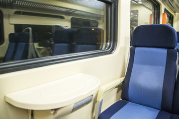 Red blue comfortable seats on the train,