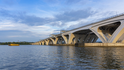 The Woodrow Wilson Memorial Bridge spans the Potomac River between Alexandria, Virginia, and the state of Maryland, as seen from Jones Point Park in Alexandria.