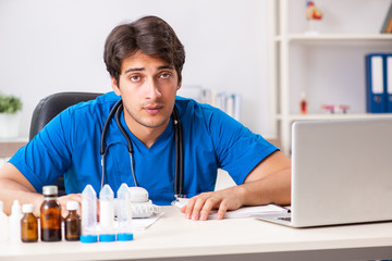 Young doctor working in the hospital