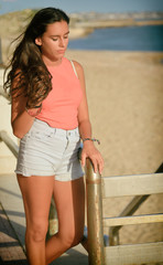 Girl with long hair at the beach