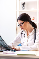 Female doctor radiologist with x-ray can image