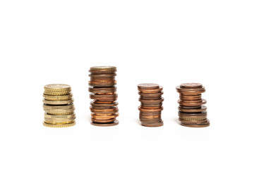 some stacked euro coins on a white surface