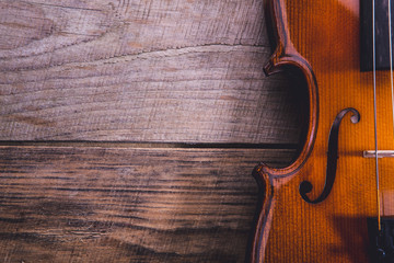 The violin on a boards background