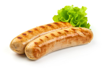 Grilled Bavarian sausages with green lettuce, isolated on white background.