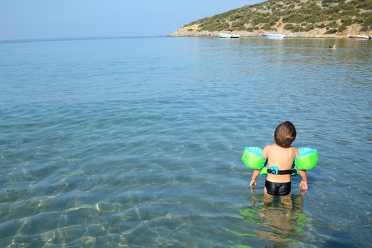 Boy playing in Aegean Sea